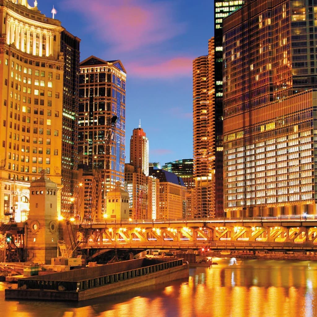 Chicago skyline at night over the river — Wrigley Building and downtown towers